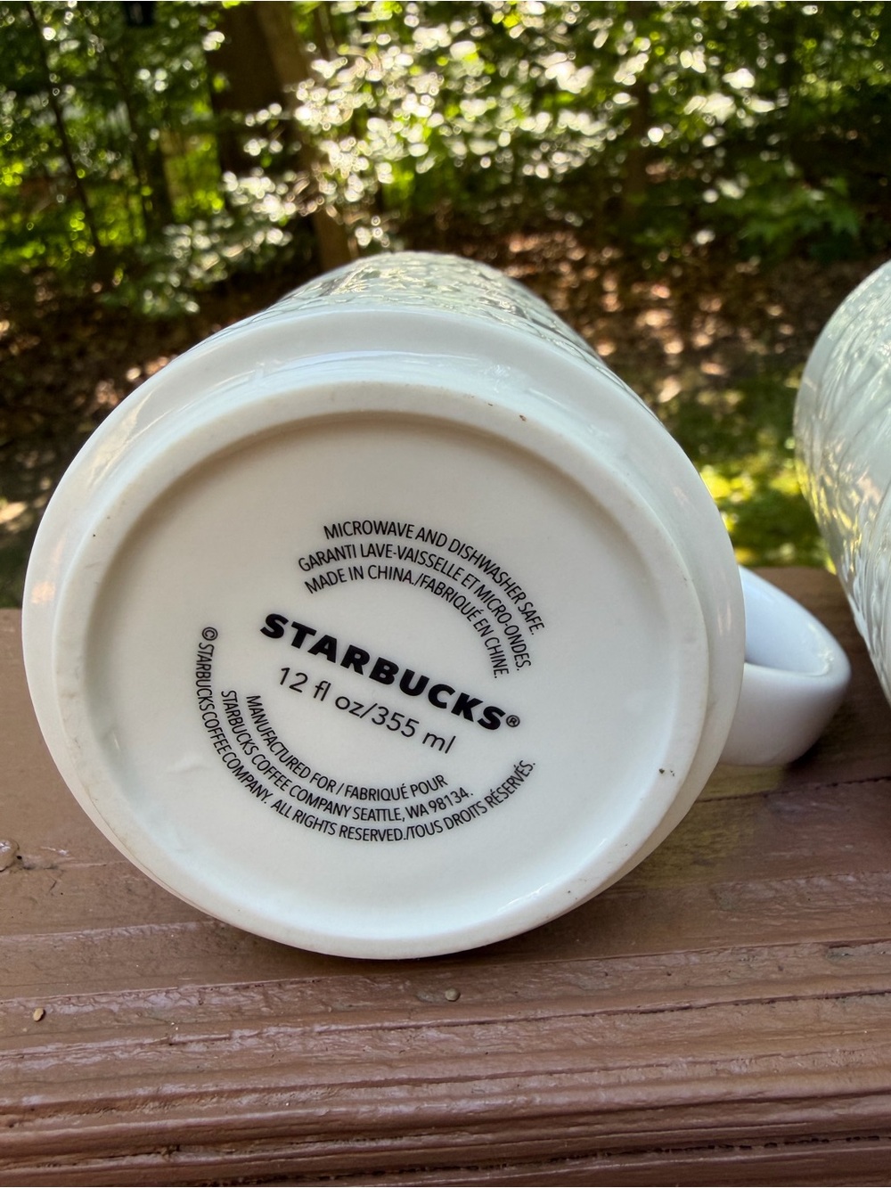 Two Starbucks 12 oz ceramic mugs with embossed daisy or sunflower floral design - Picture 12 of 14